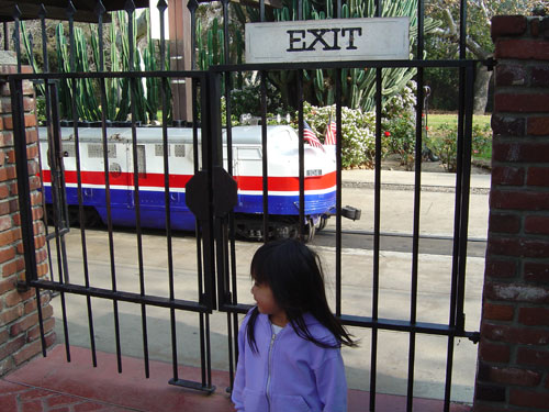 sister in front of train